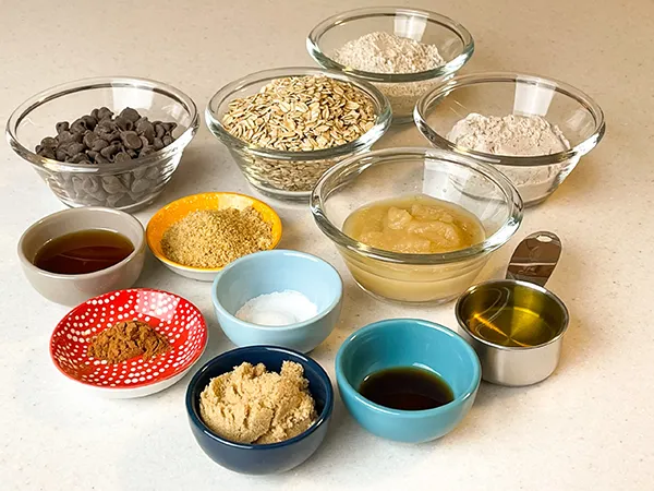 all the ingredients in small bowls to make the best vegan chocolate chip cookies